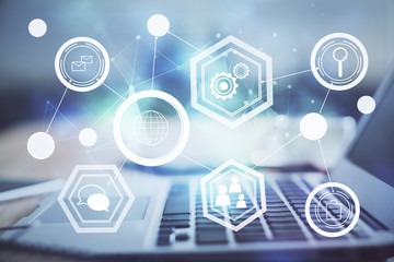 Computer on desktop with social network theme icon. Multi exposure. Concept of international connections.