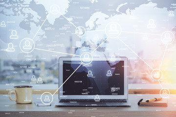 Computer on desktop with social network theme icon. Multi exposure. Concept of international connections.