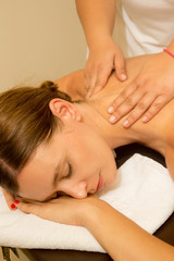 Fototapeta na wymiar Oil back massage, a woman in the spa having aromatherapy massage with essential oil 