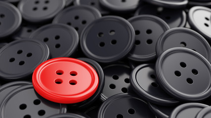 Unique red sewing button among black ones