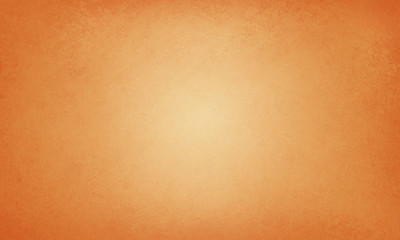 orange autumn thanksgiving background with vintage texture with soft yellow center, elegant fall halloween background