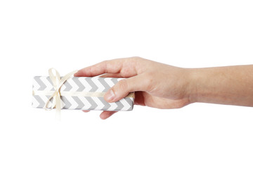 Hand gives a gift isolated on a white background.