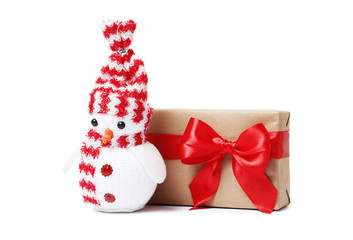 Creative snowman with gift box isolated on a white background.
