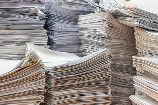 bundles bales of paper documents. stacks packs pile on the desk in the office