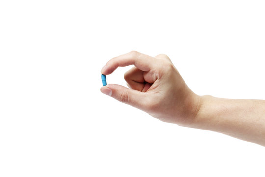 Hand Man Holding Blue Pill On White Background, Close Up