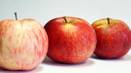  three apples on a light background