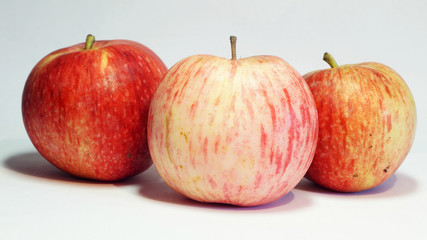 Fototapeta na wymiar three ripe juicy red-yellow apples