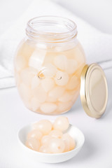 Pickled onions close-up on a white background. Fermented foods