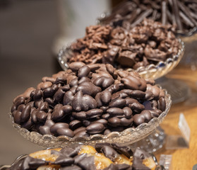 Chocolate almonds in decorative glass bowl