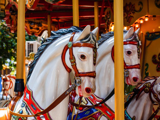 Fototapeta na wymiar Old carousel horses in Lignano, Italy