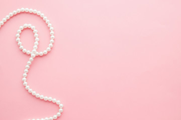Pearls on pastel pink background - 298091989