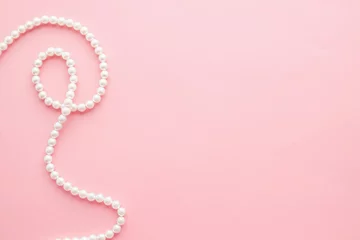 Pearls on pastel pink background © iryna1