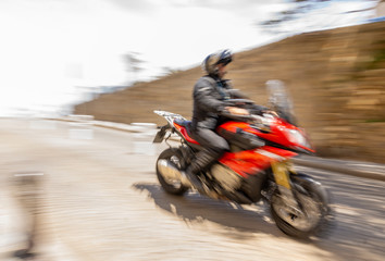 Fototapeta premium Biker, motorcyclist, moto, bike, motorcycle, speed, blur, blurry, movement, red, man