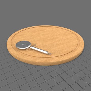 Pizza cutter on cutting board