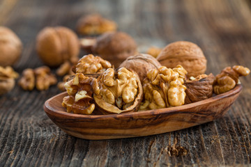 Handful of Walnuts on wooden background