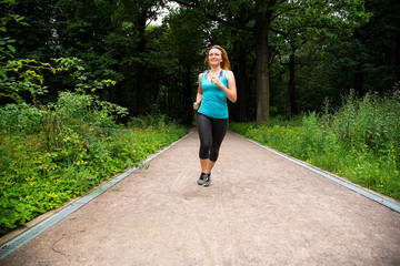 Beautiful girl running in the Park