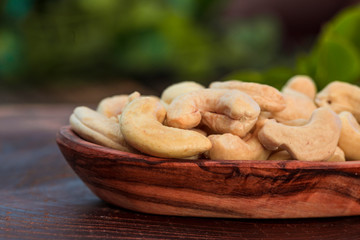 Cashew nuts on a rustic wooden background
