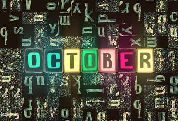 Word October month as neon glowing letters with light symbols over dark abstract background pattern