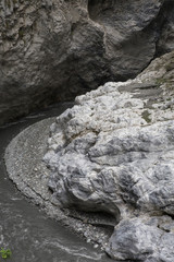 Taroko Gorge is an impressive 19-km-long canyon, situated near Taiwan's east coast. The area of the gorge is also identified as Taroko Gorge National Park. The upward thrust of hard rock, combined wit