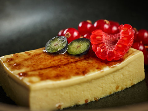 Closeup palatable mousse de foie with ripe berries served on plate in restaurant