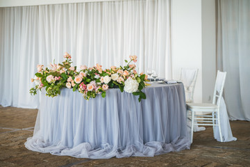 Luxury wedding table decoration. Special event table set up. Fresh flower decoration. Pastel colors - blue and pink decoration