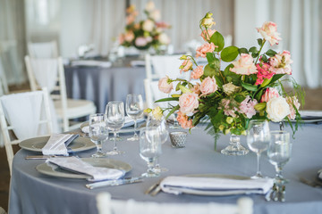 Luxury wedding table decoration. Special event table set up. Fresh flower decoration. Pastel colors - blue and pink decoration