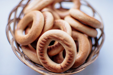 bagels in a wicker basket on a white background, isolate. Tea Party Concept