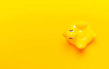 Creative summer beach concept. Inflatable mini yellow chicken or duckling on yellow background, pool float party. Flat lay copy space. Trend Inflatable Children toy for swimming. Layout for design