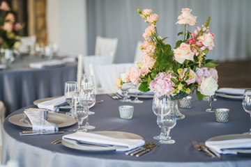 Luxury wedding table decoration. Special event table set up. Fresh flower decoration. Pastel colors - blue and pink decoration
