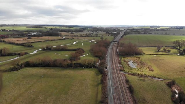 Aerial View Of Railway, Kettering To London Line In Northamptonshire Countryside.