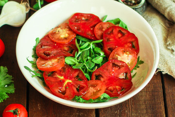 healthy salad tomatoes (vegetables, onions, greens, lettuce, sunflowers, microgreens and more) menu concept. food background. copy space. Top view