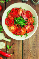 healthy salad tomatoes (vegetables, onions, greens, lettuce, sunflowers, microgreens and more) menu concept. food background. copy space. Top view