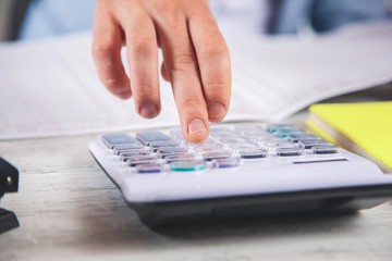 man hand calculator and  document