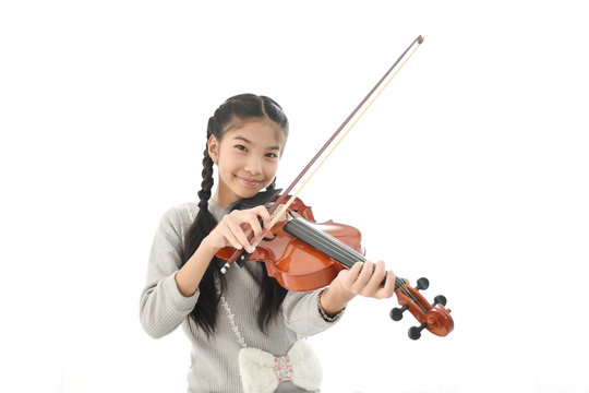 girl playing violin isolated on white