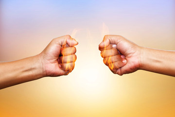 Two hands in air bumping together