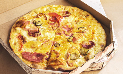 Baked fast pizza in box