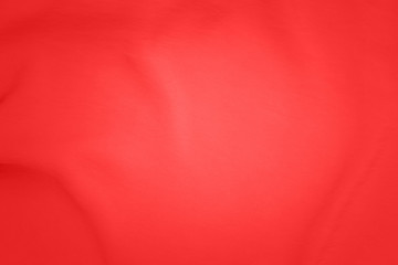 Red cloth texture, close up. Red fabric drape background. Red pink background from draped cloth....
