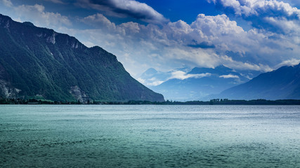 View of the mountain range,lake and the cloudy sky.Lake Geneva,mountain Alps in Montreux,canton Vaud Switzerland.