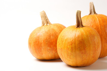 pumpkins on a colored background. Thanksgiving background. Autumn background.
