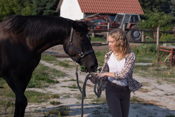 Obraz premium Young girl with her horse , pretty girl with her horse