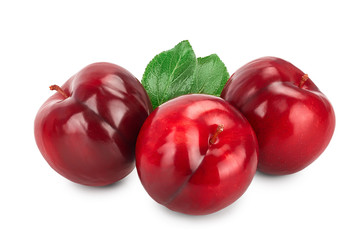 fresh red plum with leaves isolated on white background