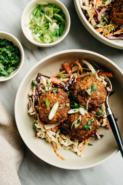 Ginger Pork Meatballs over Asian Slaw