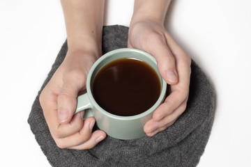 woman holding a cup of coffee tea isolated on white