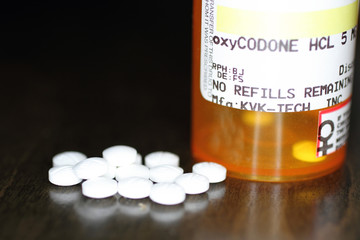 Opiod prescription pain pills on a table.