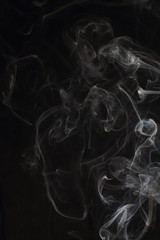 Abstract white smoke texture on black background