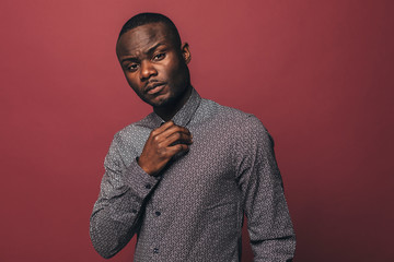 Young african american man looking at camera. Studio portrait