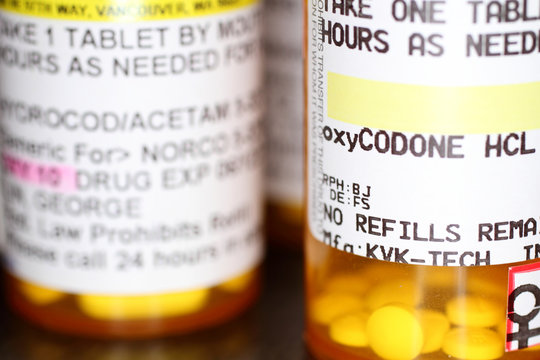 Opiod prescription pain pills on a table.