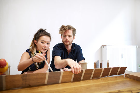 Two industrial designer working in their office 02