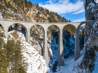 Aerial image of the Landwasser Viaduct, which ia a wonder of Swiss mountain railway engineering in 1901 and a unesco heritage since 2008.