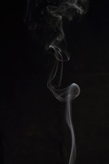 Abstract white smoke texture on black background